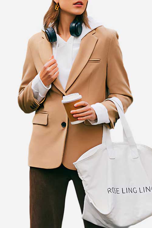 Style oversized blazer over a hoodie