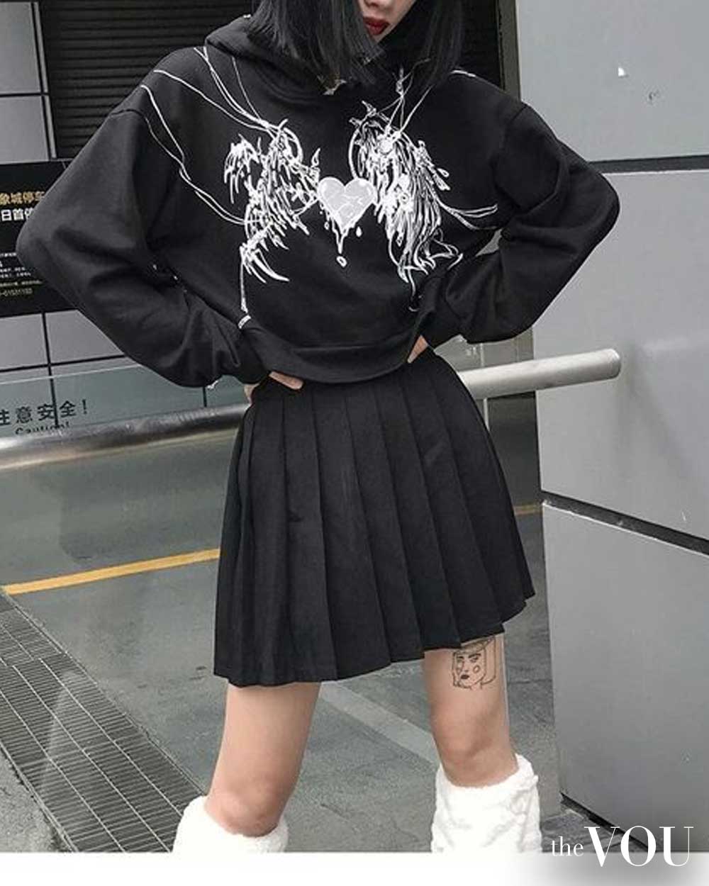 graphic sweatshirt, pleated miniskirt, legwarmer
