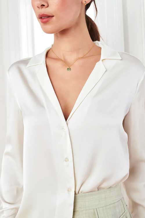 White silk notch collar button-up blouse.