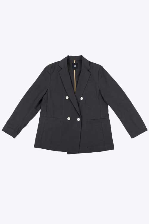 blazer features a strong silhouette, double-breasted button detail, and front pockets
