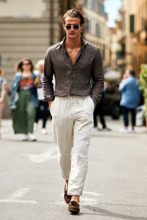 a man walking down the street in an Old Money casual aesthetic