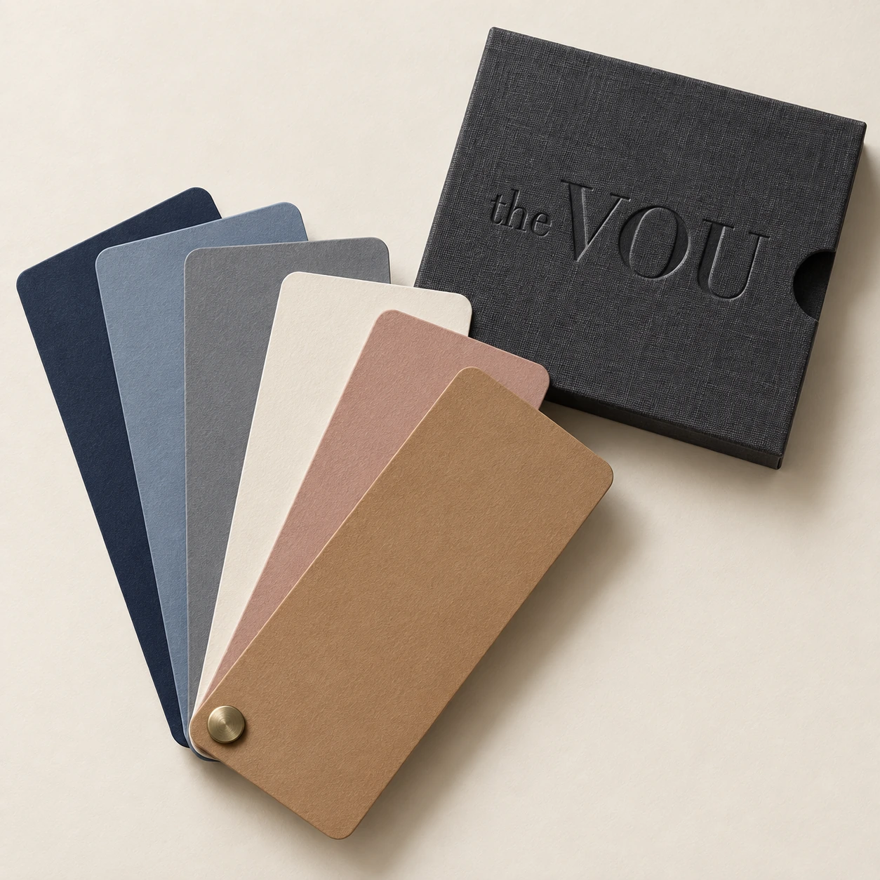 Illustrative colour cards beside an embossed The VOU case